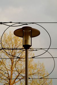 Low angle view of street light against sky