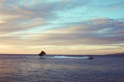 Scenic view of sea against cloudy sky