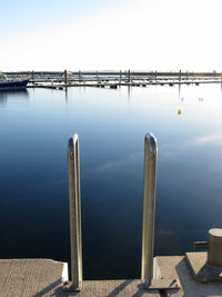 Pier over sea against clear sky