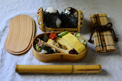 Bento with japanese food on the table   traditional wooden box