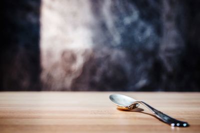 Close-up of spoon on table