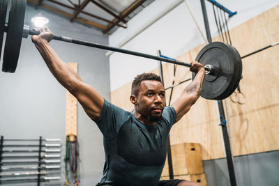 Man lifting weights at gym