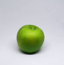 Close-up of apple against white background