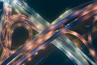 High angle view of light trails on highway at night