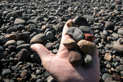 Human hand on rock