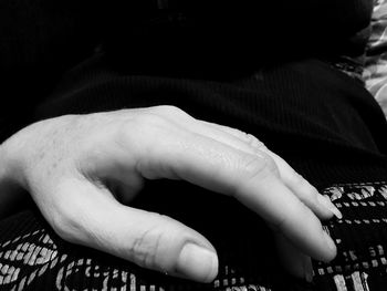 Close-up of hands playing piano