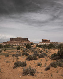 Rock formations on landscape against sky