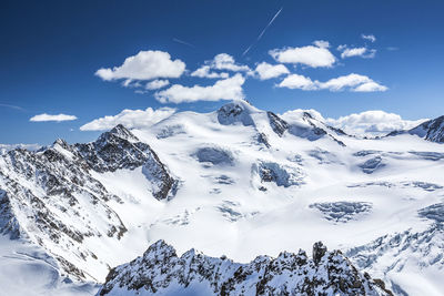 Scenic view of snowcapped mountains against sky