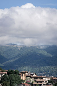 High angle view of townscape and mountains against sky