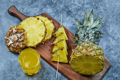 High angle view of lemon slice on cutting board