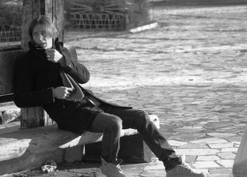 Portrait of young men sitting on seat