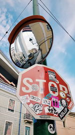 Low angle view of road sign against building