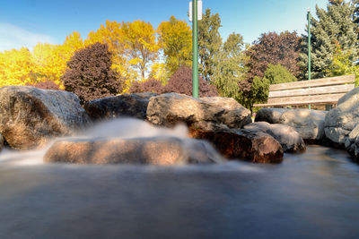 Scenic view of waterfall against sky