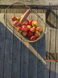 High angle view of apples on wooden table