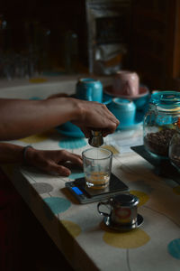 Weighing the milk in the glass. coffee kitchen