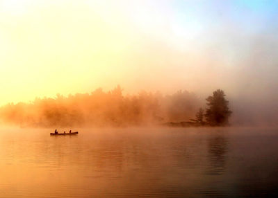 Scenic view of lake during sunset