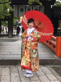 Portrait of smiling young woman in temple