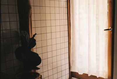 Rear view of woman standing on wall