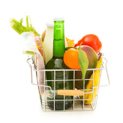 Close-up of fruits in basket against white background