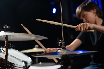 Portrait of boy playing drum