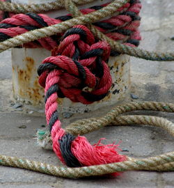 Close-up of ropes tied on bollard