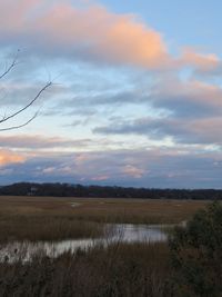 Scenic view of landscape against sky during sunset