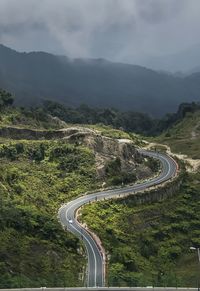 High angle view of road amidst mountains against sky