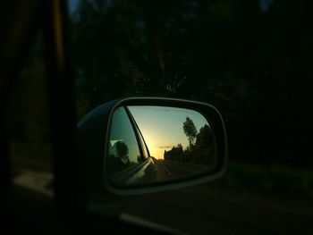 Reflection of car on side-view mirror