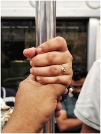 Close-up of hand holding glass