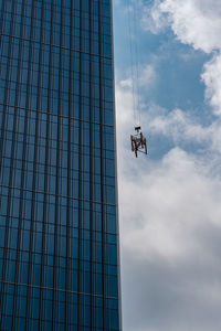 Low angle view of office building against sky