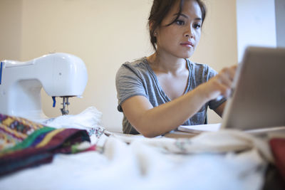 Young woman working on a tablet pc