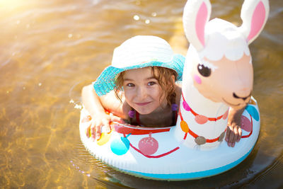 Portrait of smiling girl in swimming pool