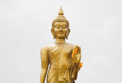 Low angle view of statue against sky