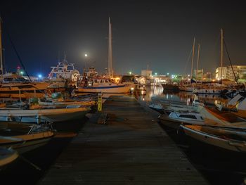 Boats moored at harbor