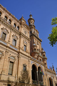 Low angle view of building against blue sky