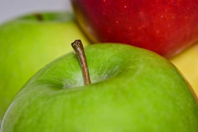 Close-up of apple on green leaf