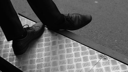 Low section of man standing in bus