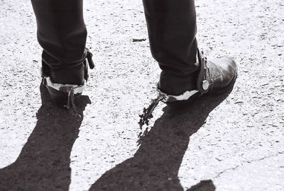 Low section of woman standing on tiled floor