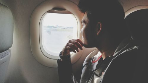 Man sitting in airplane