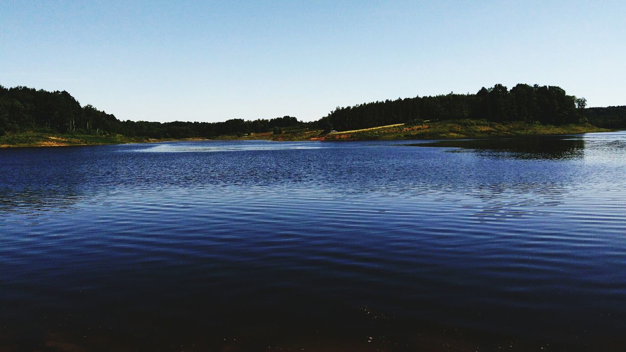 water, tree, nature, tranquil scene, beauty in nature, lake, tranquility, waterfront, scenics, rippled, outdoors, no people, clear sky, day, blue, sky