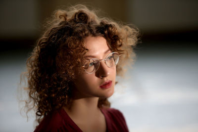 Close-up of young woman looking away