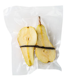 High angle view of fruit in plate against white background