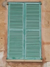 Closed window on wall of building