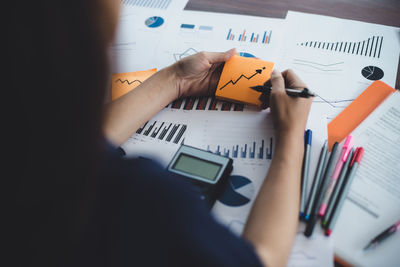 Close-up of businesswoman analyzing document in office