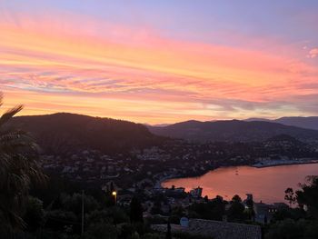 Townscape against sky during sunset