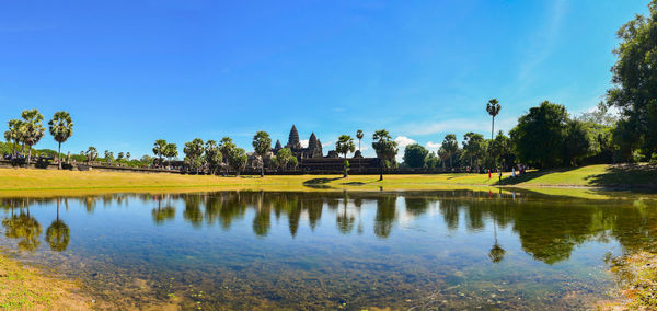 Scenic view of lake against blue sky