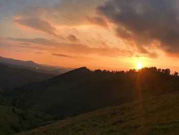 Scenic view of landscape against sky during sunset