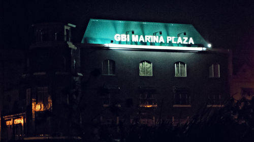 Illuminated text on building