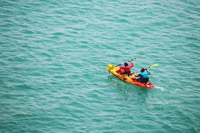 High angle view of people on boat in sea