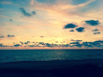 Scenic view of sea against sky at sunset